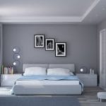 Kamar tidur minimalis dengan dinding abu-abu dan tempat tidur sederhana